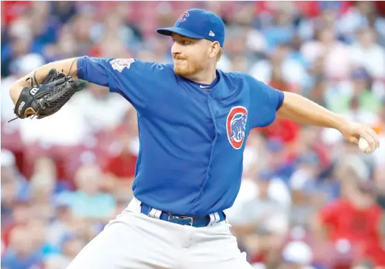  ??  ?? Mike Montgomery took Jon Lester’s turn in the rotation Wednesday and threw six scoreless innings. He coaxed the Reds into making 11 groundouts. | ANDY LYONS/ GETTY IMAGES