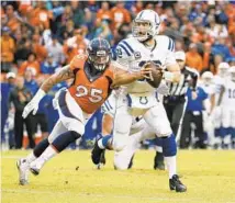  ?? JACK DEMPSEY/AP ?? Derek Wolfe, playing for the Broncos, pursues Colts quarterbac­k Andrew Luck during a 2015 playoff game.