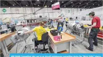  ??  ?? ABU DHABI: Competitor­s take part in an aircraft maintenanc­e competitio­n during the “World Skills” internatio­nal competitio­n yesterday. — AFP