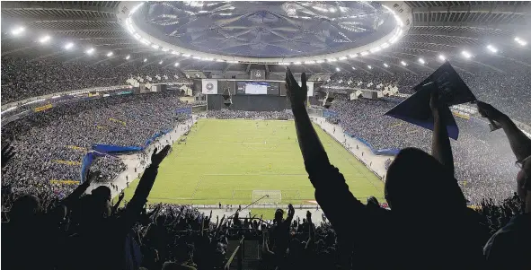  ?? — THE CANADIAN PRESS FILES ?? A sellout crowd of 61,004 filled Montreal’s Olympic Stadium to cheer on the Impact against Mexico’s Club America during their CONCACAF Champions League final last year. Next Tuesday night’s MLS showdown with Toronto FC will pack the house again.