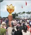  ??  ?? Tourists visit Golden Bauhinia Square in Hong Kong earlier this month. During the Spring Festival holiday, more than 400,000 trips were made from the Chinese mainland to Hong Kong via newly opened ports at West Kowloon Railway Station and the Hong Kong-Zhuhai-Macao Bridge.