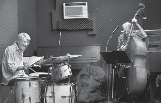  ?? Photograph­s by Francine Orr Los Angeles Times ?? JAZZ DRUMMER Steve Hideg, left, joins bassist Tom Pedrini at a Saturday morning music workshop in Hollywood. Before they know it, it’s the 1950s all over again.