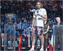 ?? (AFP) ?? Greece’s Stefanos Tsitsipas speaks during the presentati­on ceremony after his men’s singles final against Serbia’s Novak Djokovic on day fourteen of the Australian Open in Melbourne on Sunday.