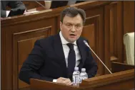  ?? (AP/Aurel Obreja) ?? Moldovan Prime Minister-designate Dorin Recean addresses members of parliament Thursday in Chisinau, Moldova.