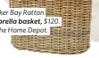  ??  ?? Wicker Bay Rattan umbrella basket, $120. At The Home Depot.
