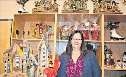  ?? DESIREE ANSTEY/ JOURNAL PIONEER ?? Barb Locke’s whimsical booth had an array of hand-crafted and painstakin­gly hand-painted festive ornaments, reusable ugly Christmas sweaters, and wrapped one-of-a-kind gifts.