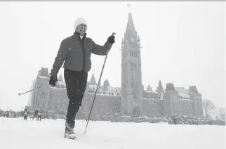  ?? ADRIAN WYLD/THE CANADIAN PRESS FILE ?? Sen. Nancy Greene Raine skies around the front lawn of the Parliament buildings during an event promoting the National Health and Fitness day in Ottawa on Feb. 24, 2016.