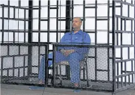  ?? REUTERS ?? Jaula. Saif al Islam Kadafi, en mayo de 2014, durante un juicio.