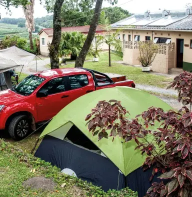  ??  ?? PODIUM FINISH. There are two long terraces on which to pitch your tent. The ablution facilities are at the far end of the lower terrace.