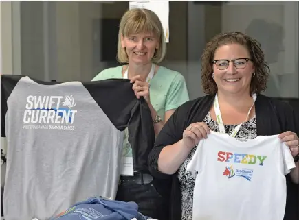  ?? SCOTT ANDERSON/SOUTHWEST BOOSTER ?? Western Canada Summer Games Manager Denise Barbier and Swift Current Games co-chair Melissa Shaw show off some of the new 2019 Games clothing which is now available.