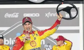  ?? John Raoux, The Associated Press ?? Joey Logano celebrates in Victory Lane after winning the first of the two NASCAR Daytona 500 qualifying auto races at Daytona Internatio­nal Speedway on Thursday night in Daytona Beach, Fla.