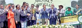  ??  ?? Members of Jayaratne Stables claimed the main trophy at the RTC Magic Million Cup - Pix by Indika Handuwala