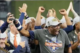  ?? DAVID J. PHILLIP — THE ASSOCIATED PRESS ?? Houston Astros manager Dusty Baker Jr., and the Houston Astros celebrate their 4-1 World Series win against the Philadelph­ia Phillies in Game 6on Saturday, Nov. 5, 2022, in Houston.