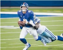  ?? MICHAELAIN­SWORTH/AP ?? Giants quarterbac­k Daniel Jones fumbles as he is sacked by Cowboys defensive end DeMarcus Lawrence on Sunday.