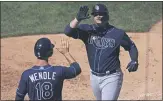  ?? ADAM HUNGER — THE ASSOCIATED PRESS ?? Tampa Bay Rays’ Mike Zunino celebrates hitting a three-run home run with Joey Wendle (18) against the Yankees during the sixth inning on Thursday.