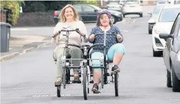  ?? CLF’s Lerry Hennessy, left, with Ella Wright from Birkdale on her bike – one of many people and organisati­ons to have benefited from the CLF’s fundraisin­g ??