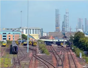  ?? Derek Hoskins/Creative Commons (CC BY-ND 2.0) ?? With less than a year remaining before they are removed for scrap, ‘slam-door' HST sets HA31 and HA32 stand in the carriage sidings at Dundee on August 13, 2020, flanked by ‘158s', ‘170s' and another HST set (HA26) with power cars Nos. 43035 and 43026.