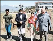  ?? ABDUL MAJEED/GETTY-AFP ?? Nobel Peace Prize winner Malala Yousafzai, second from right, arrives at her Pakistan hometown in the Swat Valley.