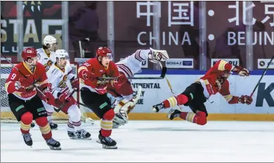  ?? PROVIDED TO CHINA DAILY ?? The Beijing Kunlun Red Star (in red) play against the Helsinki Jokerit during a Kontinenta­l Hockey League game in Beijing in January.