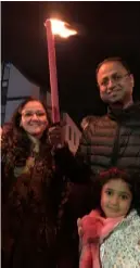  ?? ?? WINNER: Rewa Kulkarni (6) led the countdown to the fireworks with Mum Copulate and Dad Akshay, after winning the children’s drawing competitio­n