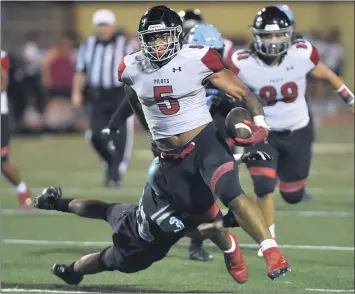  ?? PHOTOS BY ROBERT CASILLAS ?? Banning running back Jakob Galloway can’t be stopped on this TD run, one of four to go with his 385 yards rushing.