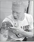  ?? AP/Fort Worth Star-Telegram/MAX FAULKNER ?? TCU sophomore point guard Jaylen Fisher used basketball to overcome his anxiety about being an albino as he was growing up. He even used it as motivation during an AAU game in Arkansas when an opposing player doubted his ability because of his albinism.