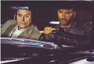  ??  ?? Shadow Moon (Ricky Whittle, right) agrees to work for Mr. Wednesday in Starz’s dramatic fantasy.