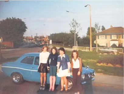  ??  ?? Above, girls on their way out for the night stop for a photo beforehand. Dig that Ford Escort!