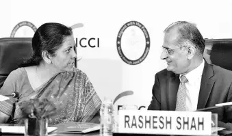  ?? BS PHOTO ?? Ficci President Rashesh Shah and Defence Minister Nirmala Sitharaman at an event in New Delhi on Monday