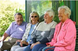  ?? ?? AT HOME: Julie (second from right) says that the friends she has made at the Oddfellows have helped her to feel like she belongs in her new community.