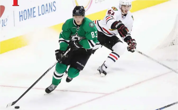  ??  ?? DALLAS: Ales Hemsky #83 of the Dallas Stars skates the puck against Trevor van Riemsdyk #57 of the Chicago Blackhawks in the third period at American Airlines Center on Tuesday in Dallas, Texas. — AFP
