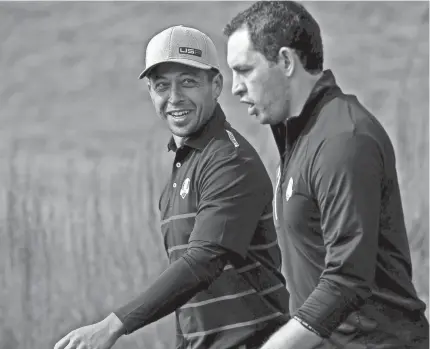  ?? ORLANDO RAMIREZ/USA TODAY SPORTS ?? Americans Xander Schauffele, left, and Patrick Cantlay scored a 5-and-3 victory over Europe's Rory McIlroy and Ian Poulter during the Ryder Cup on Friday morning at Whistling Straits.