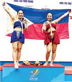  ?? ?? ISLAY ERIKA Bomogao (left) and Rhichein Yosorez display their gold medals after topping the Wai Kru Mai Muay all-female event yesterday. (Photo from Pearl Managuelod)