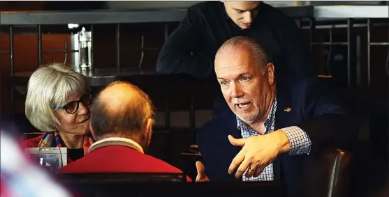  ?? JOE FRIES/Daily Courier ?? Premier John Horgan chats with party faithfuls during a meet-and-greet in Penticton last week.