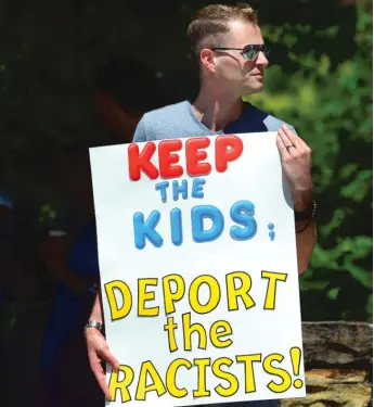  ?? BUTCH COMEGYS/ THE TIMES- TRIBUNE VIAAP FILE ?? Chris Olson holds a sign outside Lackawanna College, where U. S. Attorney General Jeff Sessions spoke on immigratio­n policy in Scranton, Pennsylvan­ia, June 15.