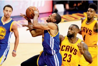  ?? Getty Images ?? Andre Iguodala (9) of the Golden State Warriors goes up against LeBron James (23) of the Cleveland Cavaliers. —