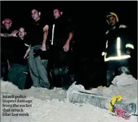  ?? PHOTO: AP ?? Israeli police inspect damage from the rocket that struck Eilat last week