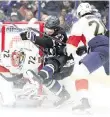  ?? NATHAN RAY SEEBECK USA TODAY Sports ?? Panthers goalie Sergei Bobrovsky makes one of his 28 saves Saturday as defenseman Josh Mahura defends against Bay Lightning center Michael Eyssimont.