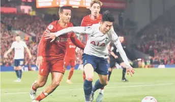  ?? — AFP photo ?? Son (right) vies with Liverpool’s Spanish midfielder Thiago Alcantara (left) and Liverpool’s Greek defender Kostas Tsimikas (centre) during the English Premier League football match between Liverpool and Tottenham Hotspur at Anfield in Liverpool.