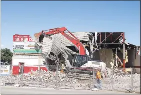  ?? (NWA Democrat-Gazette/Lynn Kutter) ?? Demolition of the old gym at the former Farmington High School campus, now Farmington Junior High School, started May 5 and continued throughout the week. The old gym was built in 1945, according to school records. Demolition also included office space and some locker rooms.