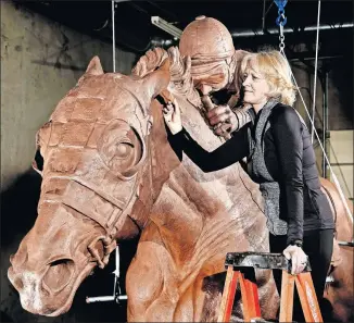  ?? [JIM BECKEL/THE OKLAHOMAN] ?? Jocelyn Russell, a sculptor from Washington, showed her recently completed statue of Secretaria­t in Norman on Monday.