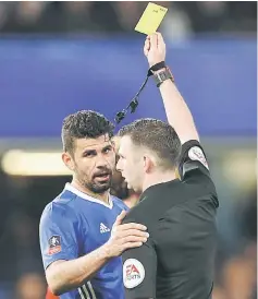  ??  ?? Chelsea’s Diego Costa (left) is shown a yellow card by referee Michael Oliver after fouling Manchester United’s Phil Jones during the English FA Cup quarter final football match at Stamford Bridge in London in this March 13 file photo. — Reuters photo