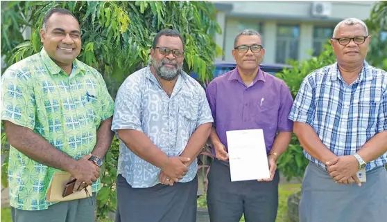  ?? Photo: ?? Fiji National University academic staff Dr Ledua Tamani, Dr Nemani Seru, College of Medicine, Nursing and Health Sciences Dean Dr William May and Mosese Salusalu with the Council of Academic Public Health Institutio­ns Australasi­a membership certificat­e.