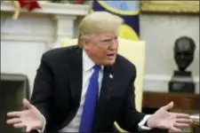  ?? EVAN VUCCI — THE ASSOCIATED PRESS ?? In this photo, President Donald Trump meets with Senate Minority Leader Chuck Schumer, D-N.Y., and House Minority Leader Nancy Pelosi, D-Calif., in the Oval Office.