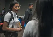  ??  ?? San Jose State student Victoria Wright speaks with a recruiter at the job fair.