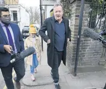  ?? JONATHAN BRADY/PA MEDIA ?? Piers Morgan speaks to reporters Wednesday outside his London home. Morgan quit the “Good Morning Britain” program Tuesday after making controvers­ial comments about Meghan in the wake of her interview this week with Oprah Winfrey.