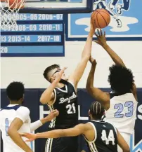  ?? ?? Oak Forest’s Robbie Avila blocks a shot by Glover