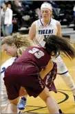  ?? Bud Sullins/Special to the Herald-Leader ?? Siloam Springs sophomore Abby Vaughn and junior Hadlee Hollenback (33) battle with Pryor (Okla.) guard Sarah Wood for the ball Saturday during the third-place game of the Jerry Oquin Invitation­al in Inola, Okla.