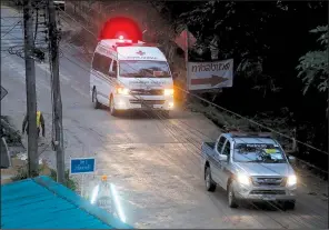  ?? AP/SAKCHAI LALIT ?? An ambulance in Mae Sai, Thailand, carries one of the boys rescued from a flooded undergroun­d cave to a hospital.