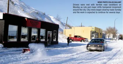  ?? NEWS PHOTO COLLIN GALLANT ?? Drivers were met with terrible road conditions on Monday as ruts and major drifts hampered movement around the city. City crews began clearing roads Sunday and the work is expected to continue for several days.